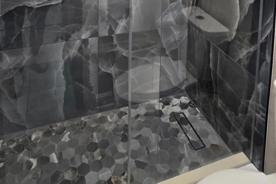 Pebble Shower Floor or Tile: Which One Holds Up Better?