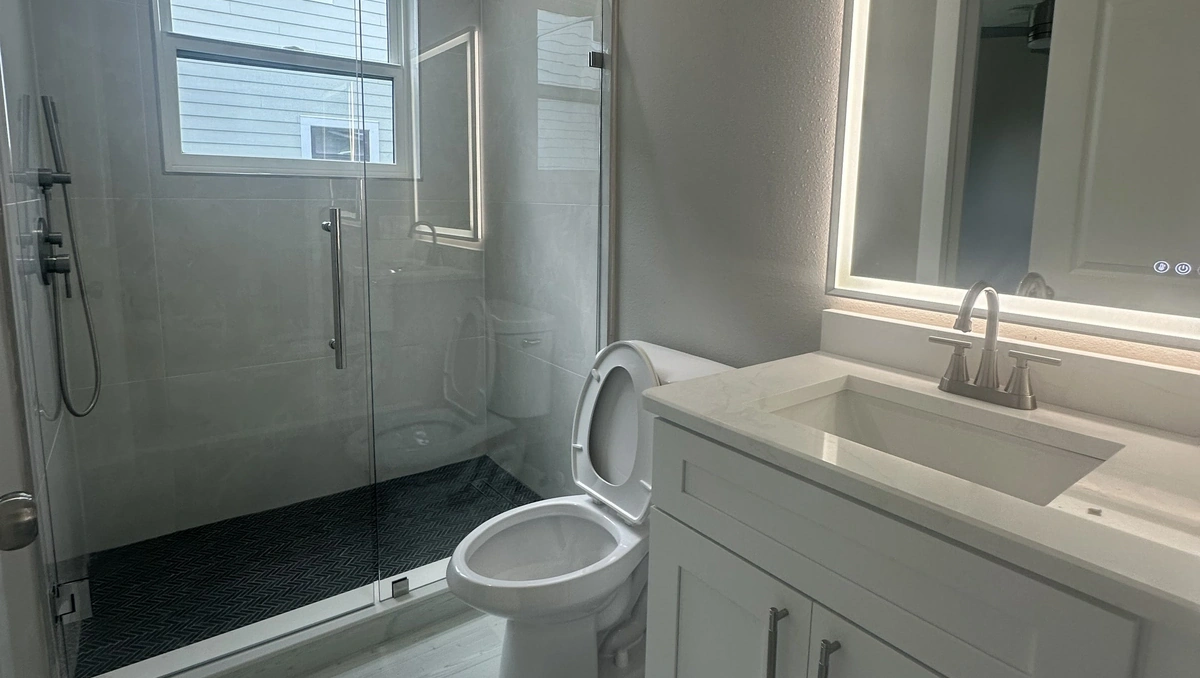 Remodeled Central Florida bathroom with a walk in shower and modern tile by Guy A Remodeling