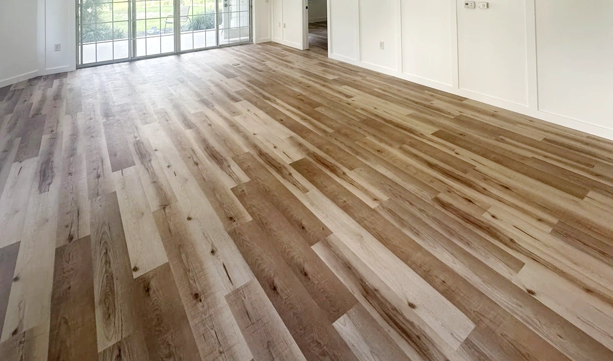 Tile and wood plank flooring installed flat and level in a remodeled Central Florida home by Guy A Remodeling