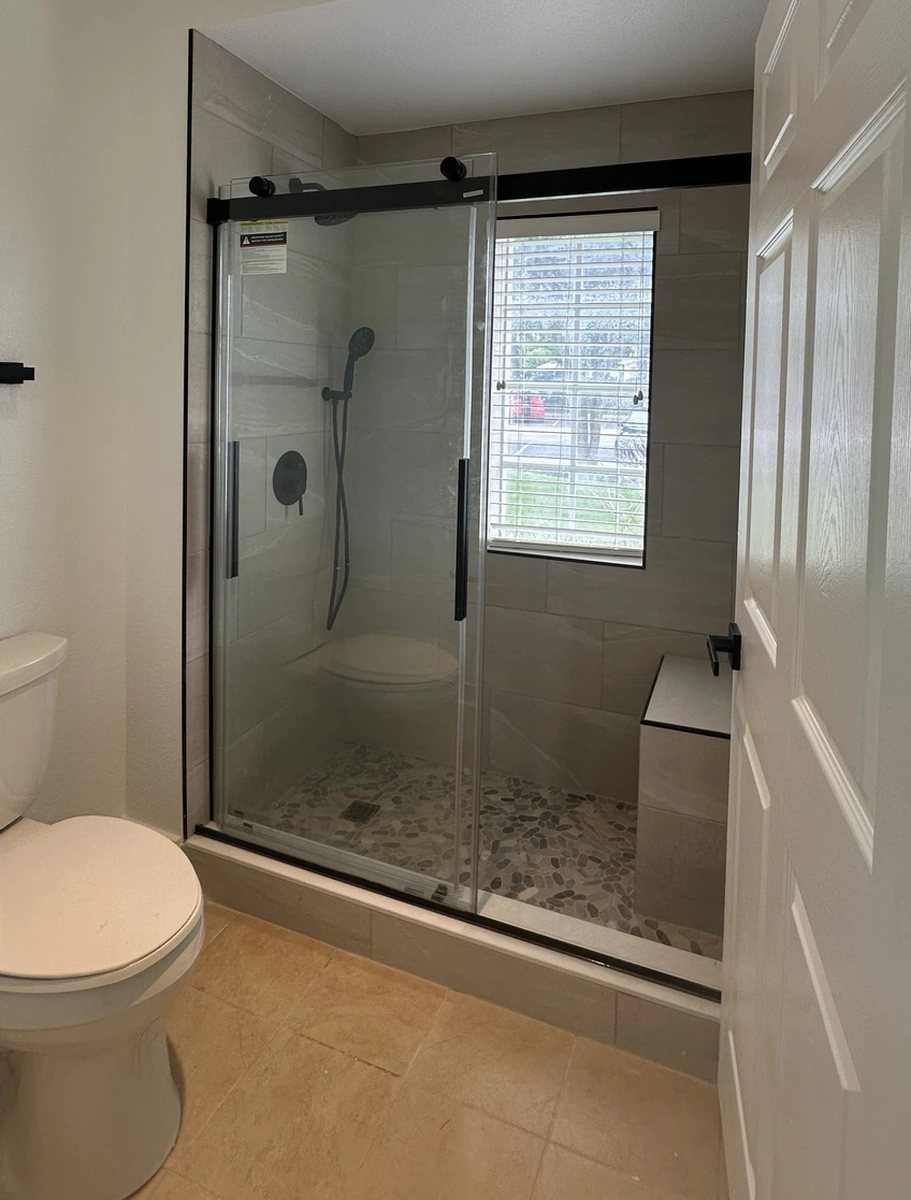 Remodeled Florida bathroom with a waterproofed walk in shower by Guy A Remodeling