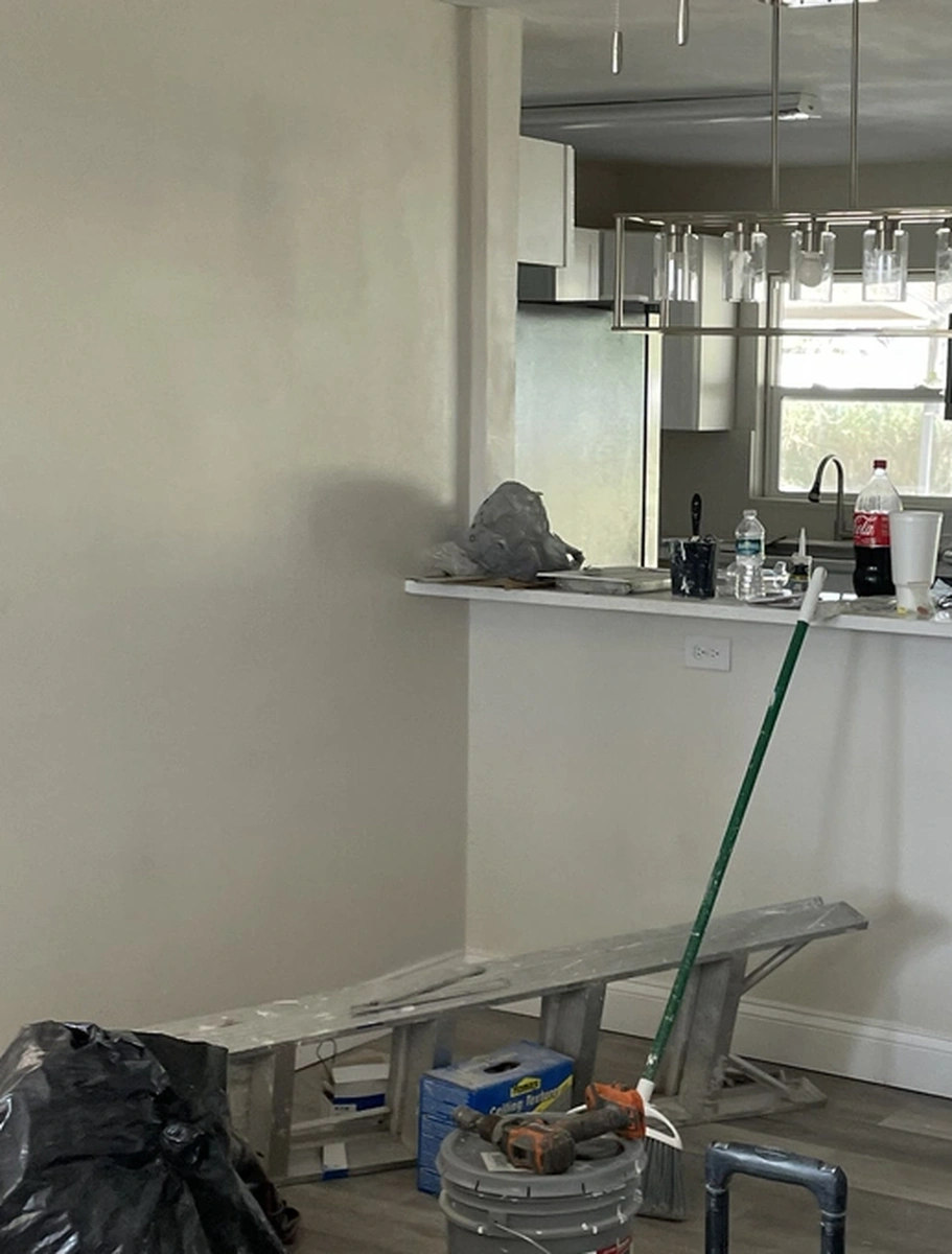 Smooth finished drywall wall with a crisp painted corner by Guy A Remodeling