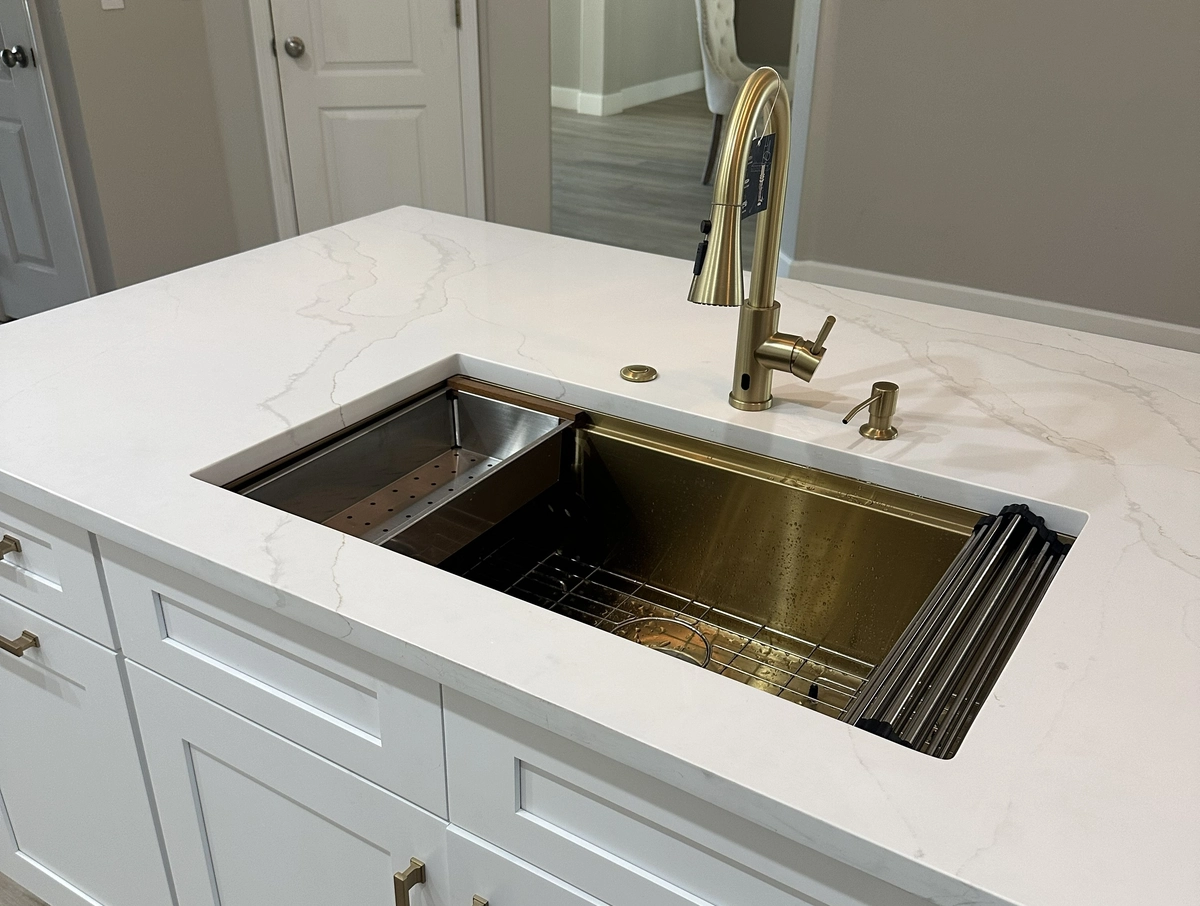 Deep single basin sink installed in a remodeled kitchen counter by Guy A Remodeling