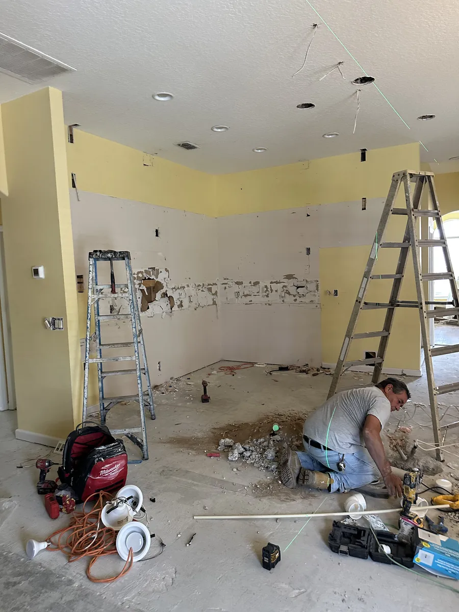 Crew removing tile and reworking the walls during the Davenport kitchen remodel
